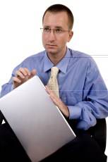 man with glasses and laptop