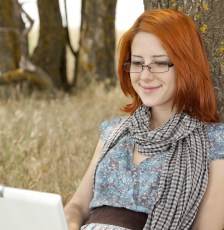 girl with glasses and laptop
