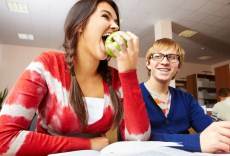 Teen girl eating apple